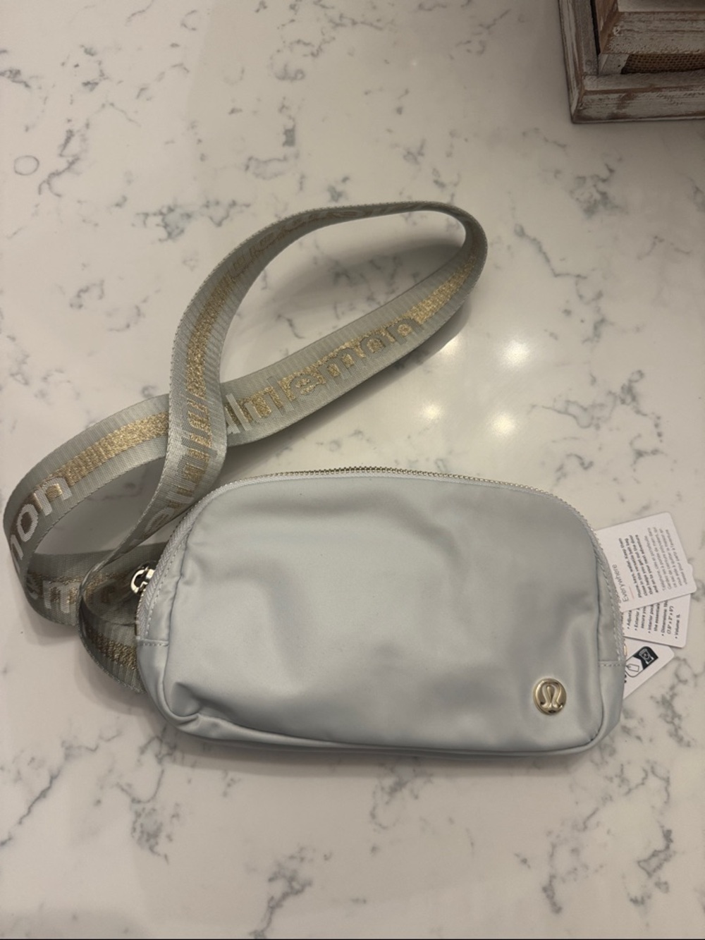 lululemon athletica Light Gray, silver and gold Crossbody with Gold Logo Strap